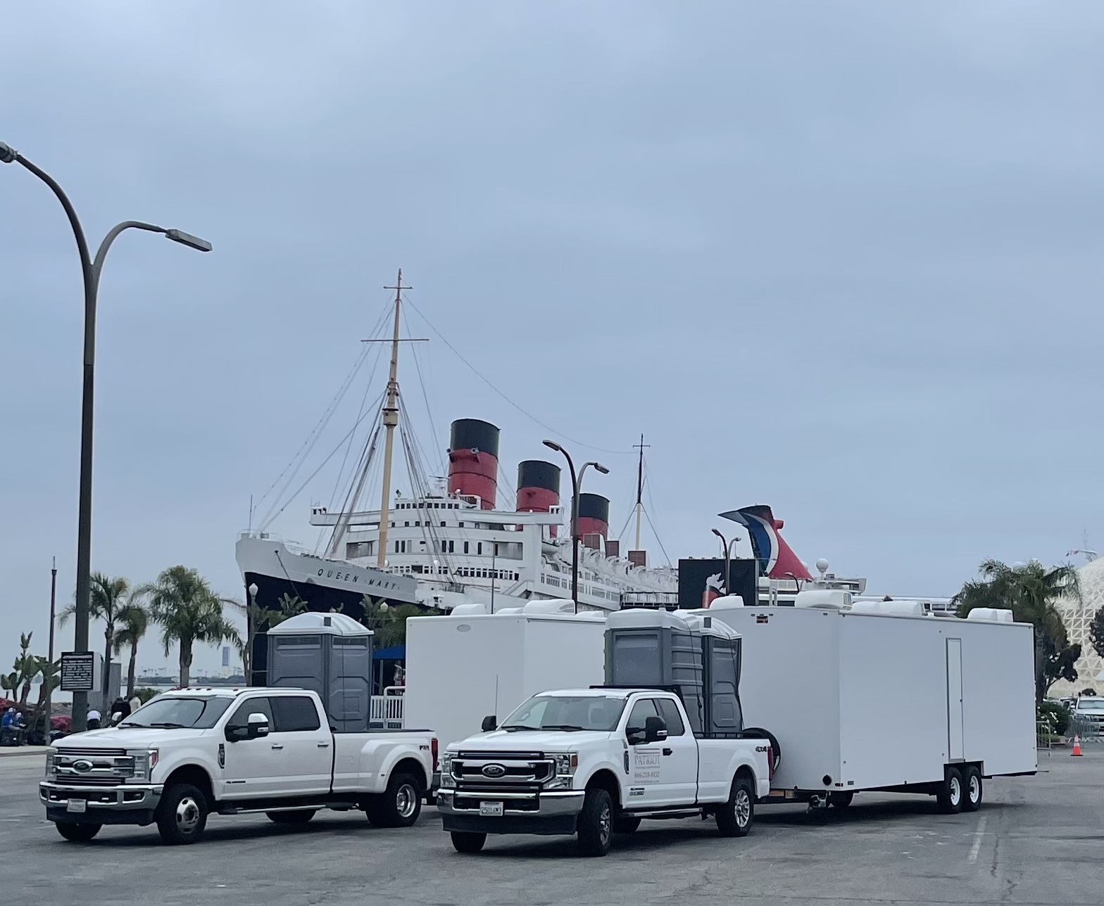 Raptor Truck Hooked up to Small Restroom Trailer